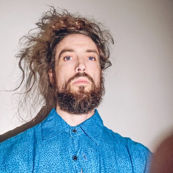 In Alex Ebert’s New Video, He’s a RollerSkating Green Screen